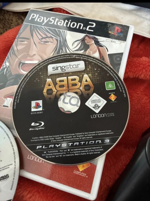 Playstation 2 com comandos e microfones