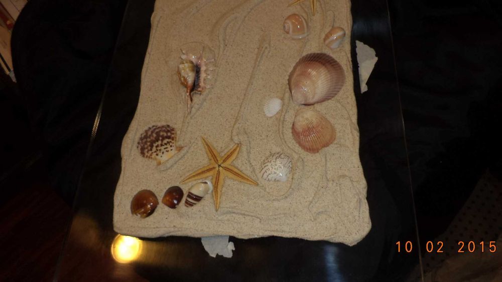 Quadro decorativo com motivos de praia em relevo