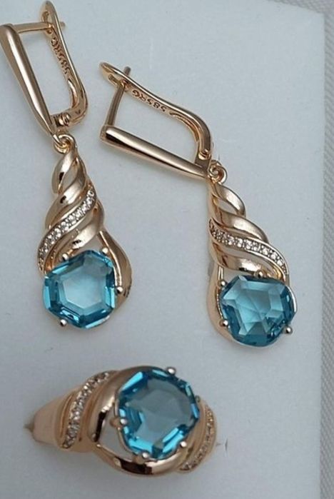 Pierścień Różowe złoto 585 czerwone oczko x 2 + komplet biżuterii