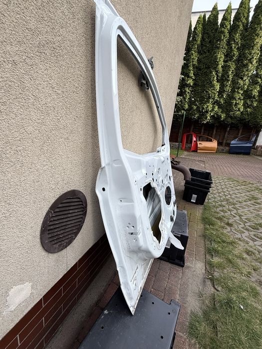 Ford transit courier MK2 drzwi lewe przód OE
