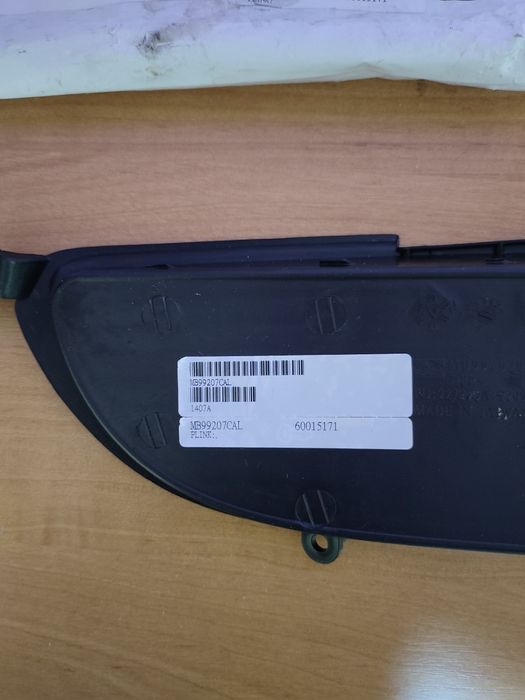 Решітка бампера Mitsubishi Lancer (ліва)