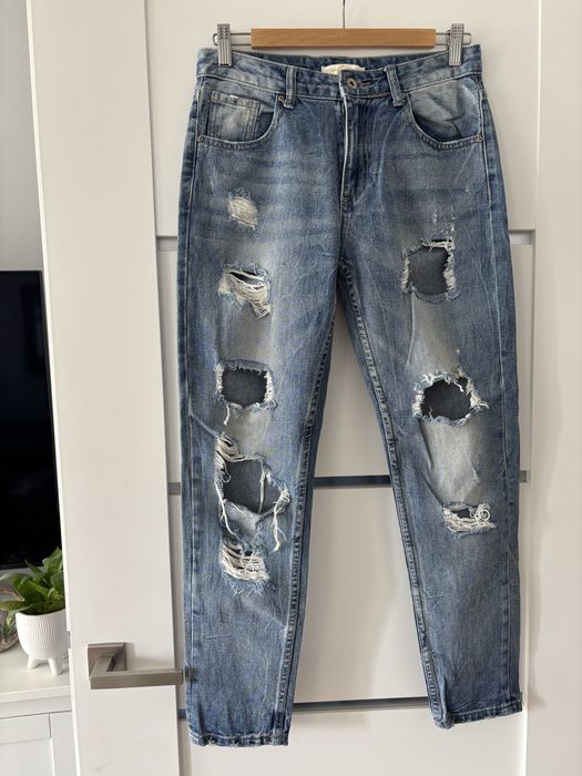 Spodnie jeansowe z dziurami na nogawkach rozmiar S