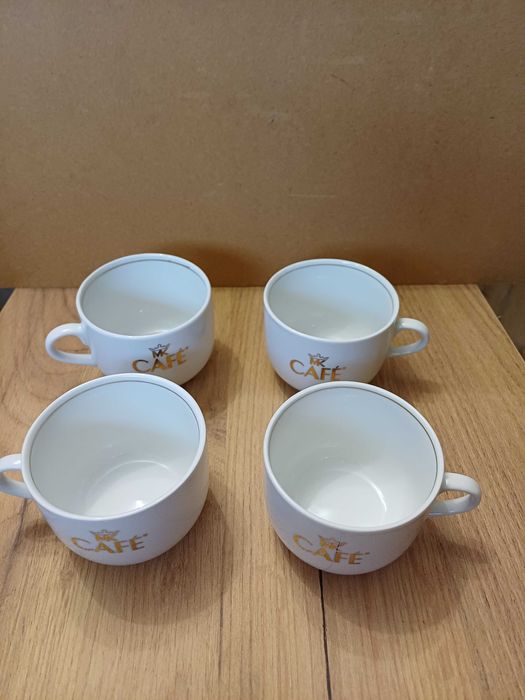 Komplet 4 filiżanek białych mc cafe ze złotym napisem i rantem