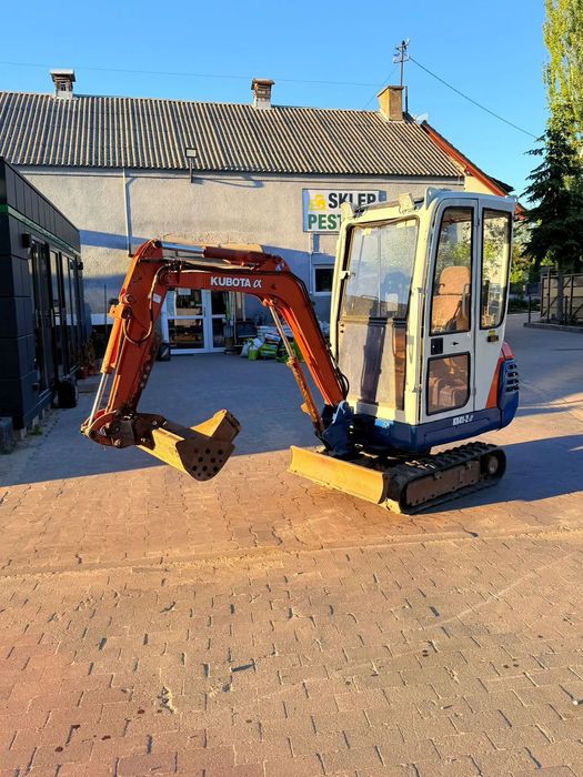 New Holland B80b  Kubota KX41-2 alfa
