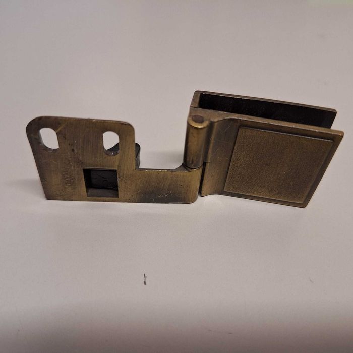 Dobradiça porta vidro (cada Un)