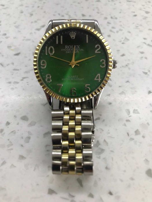 Rolex oyster perpetual day date quartz water resistant