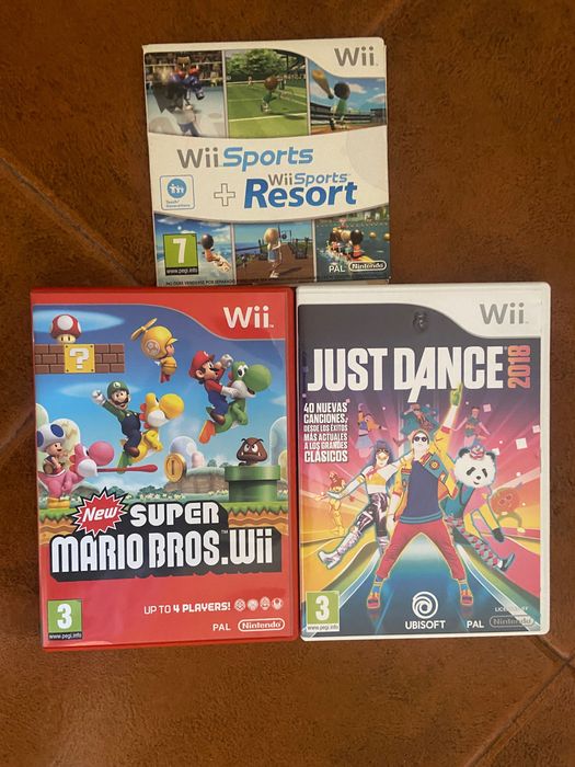 Nintendo Wii, com 3 controlos remotos + 3 jogos