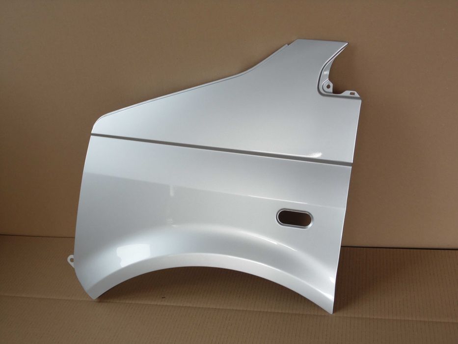 VW Transporter Multivan T5 03-15 lewy błotnik srebrny LA7W