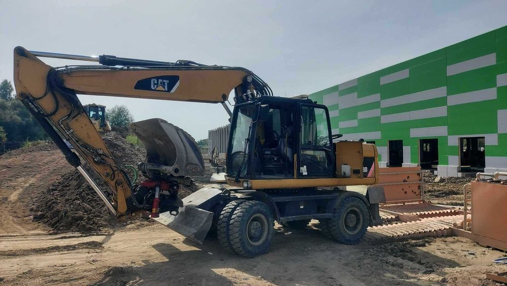 Wynajem koparki kołowej CAT m318d 18ton 20ton z rototilt bez operatora