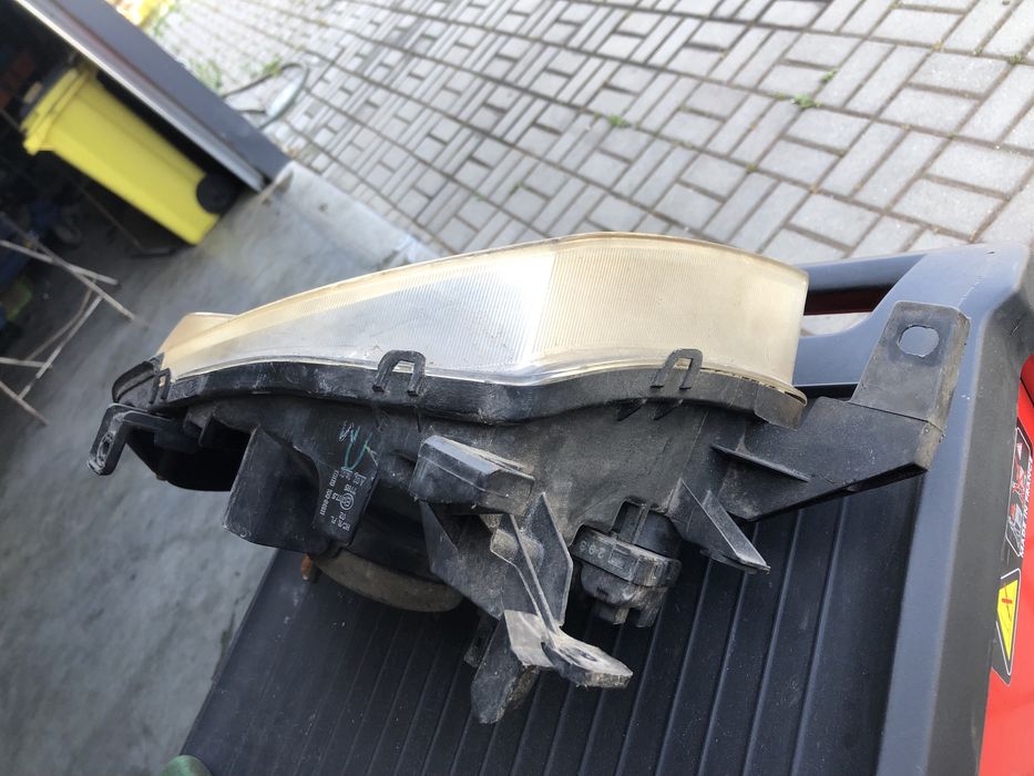Farol  esquerdo nissan navara  original
