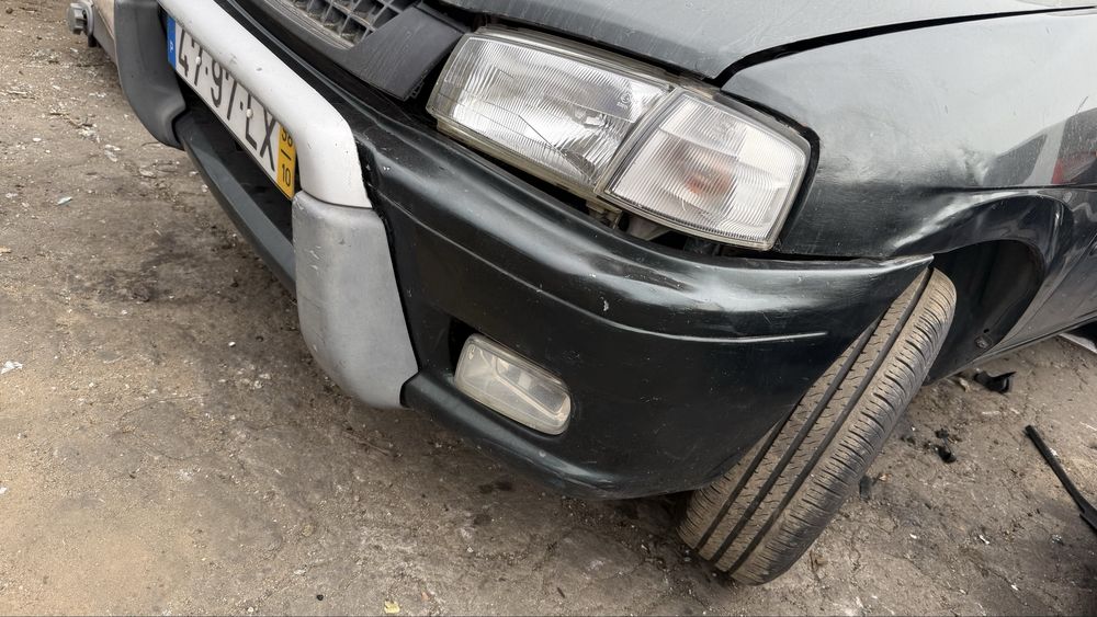 Faróis ótica e piscas  direita /esquerda Mazda demio  ano 1998