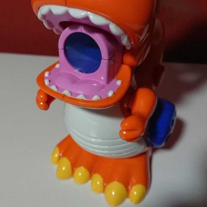 Brinquedo “Dinossauro falante”