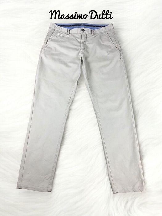 Kremowe chlopiece eleganckie spodnie chinosy Massimo Dutti