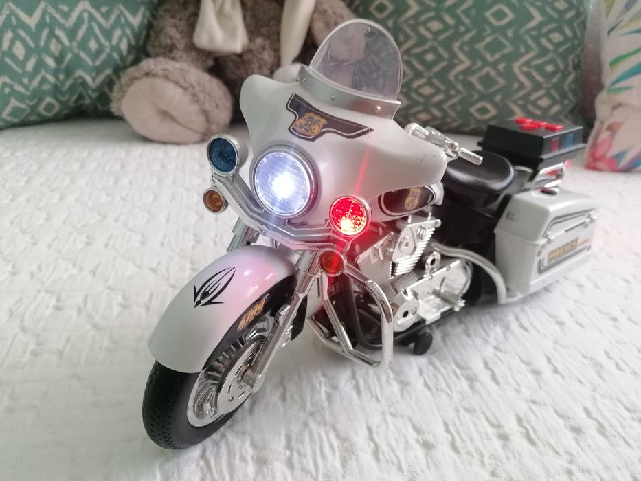 Brinquedo mota de polícia com som e luzes
