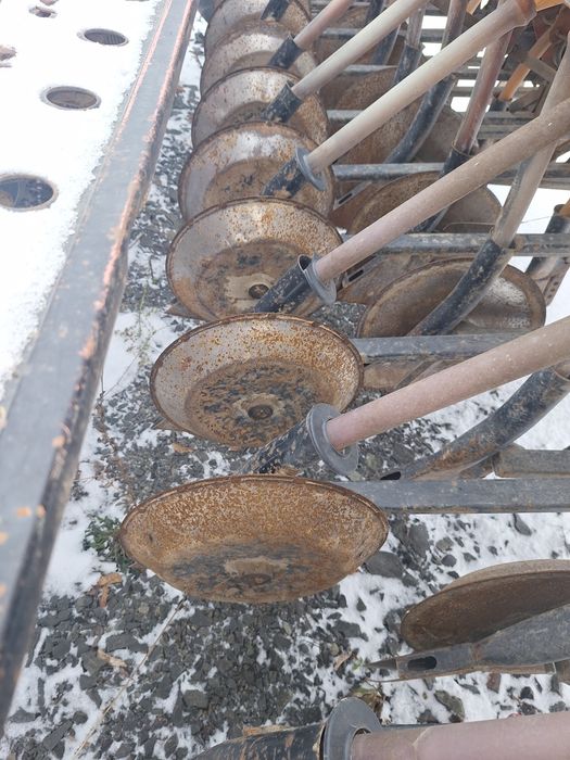 Дискова сівалка SIMULTA 2500 приципна з катками на два бачки