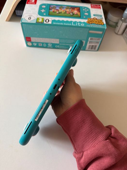 Nintendo Switch Lite c/película de vidro + capas