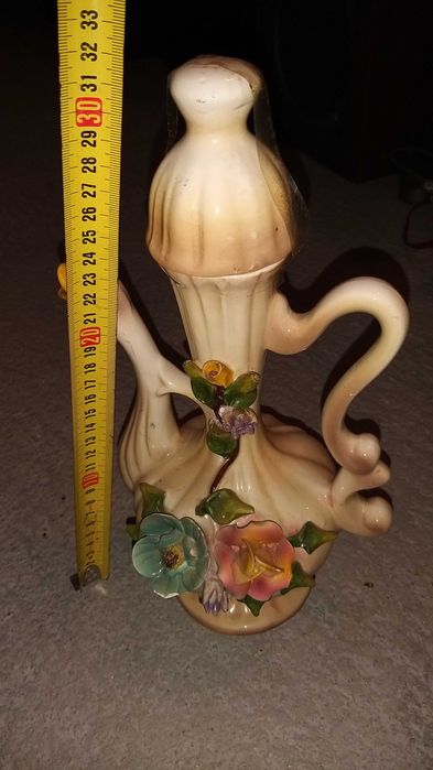 jarra em forma de pato com flores