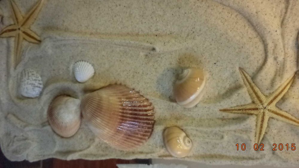 Quadro decorativo com motivos de praia em relevo