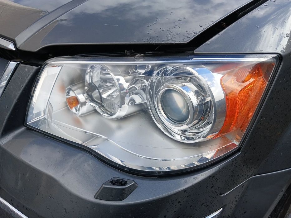 Ótica / farol esquerda CHRYSLER Grand Voyager V (RT)