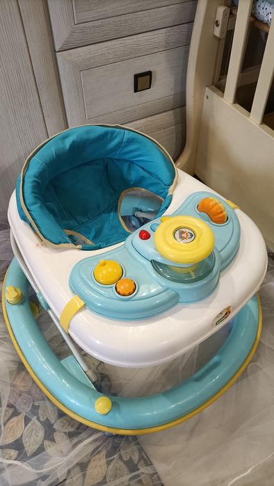 Продам музыкальные ходунки .