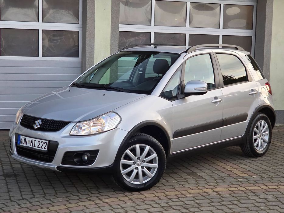 Suzuki SX4 1.6 benzyna 120km Navi Kubły Grzane Pdc Hak 1-Właściciel ORYGINAŁ LAKI