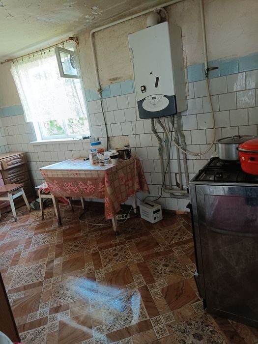 Продам 1/2будинку можна під програми та земельну ділянку 7сот.