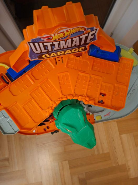 Hot Wheels mega garaż T-Rexa + samochodziki