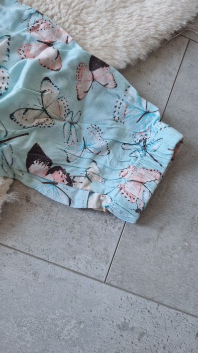 Kombinezon dziewczęcy w motyle 122/128