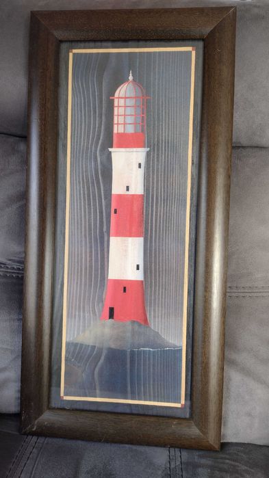 Wood-framed picture featuring a lighthouse engraving