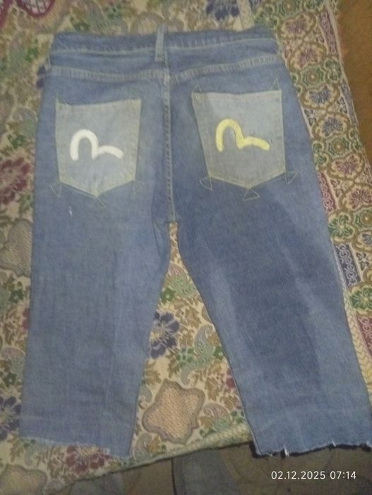 Продам джинсовые шорты evisu