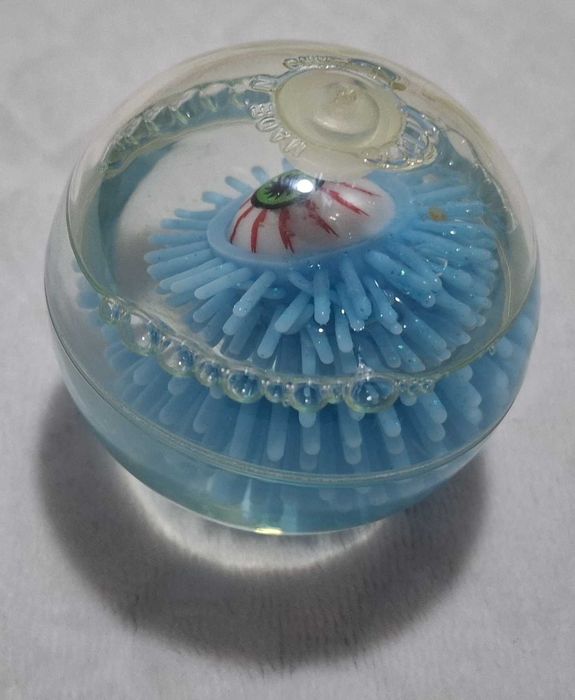 Gumowa kulka z okiem, brokatem, niebieska, 6cm (Zabawka)