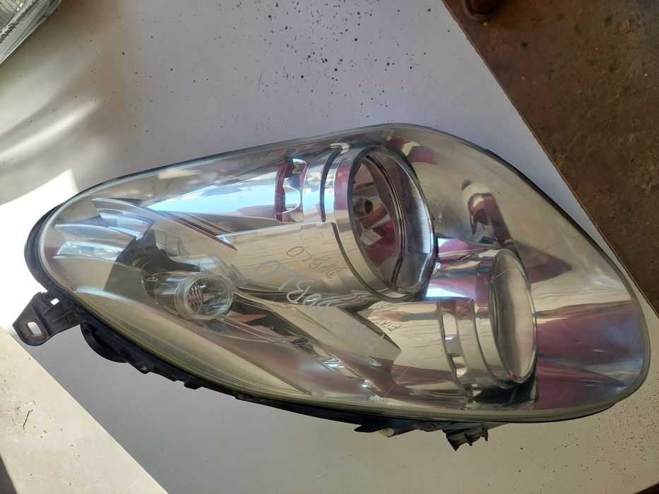 farol esq fiat doblo