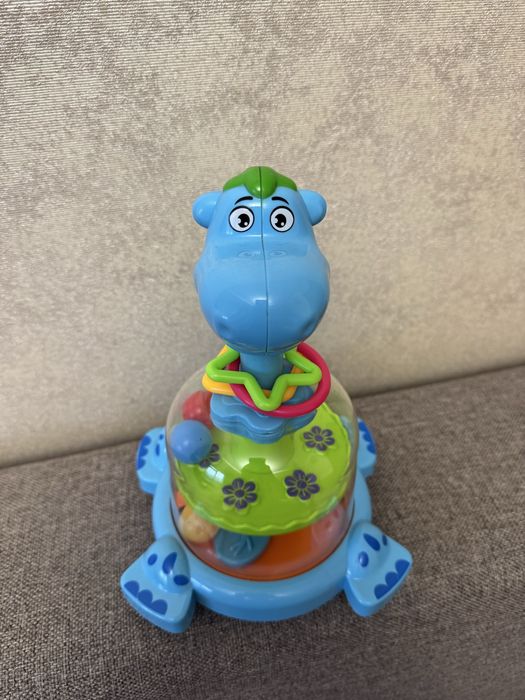 Дитяча дзига-юла бегемот з кульками