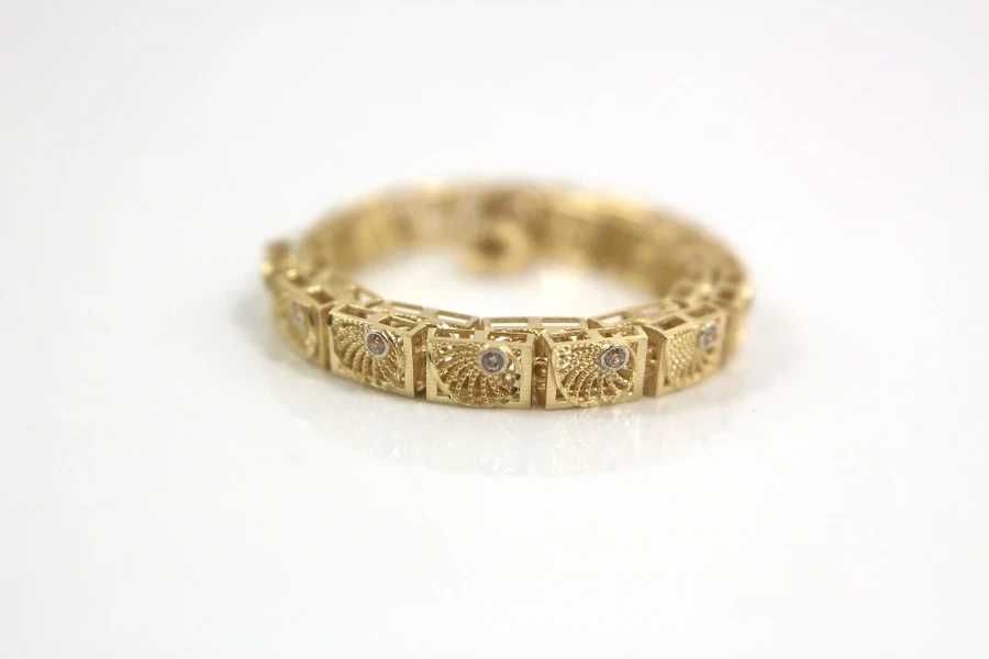 Złota ażurowa bransoletka z cyrkoniami p:585 w:5,38g r:17,5-19,5cm