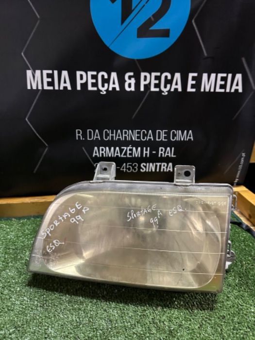 Farol esquerdo Kia Sportage 1999