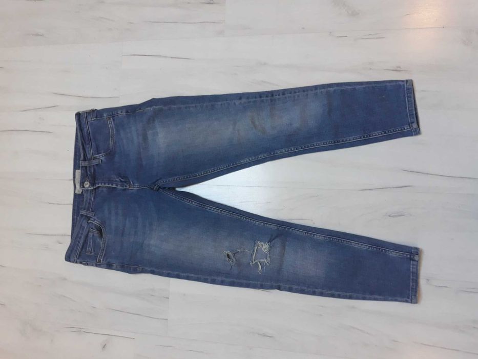 spodnie jeans top shop z dziurami