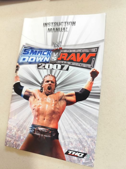 Jogo para PlayStation 2 (PS2) - Smack Down vs Raw 2007