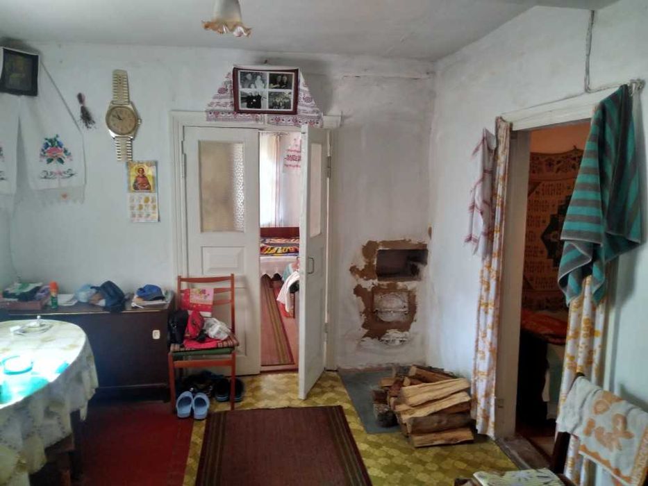 Продам дерев'яний,жилий будинок та 25сот.в с.Колонщина