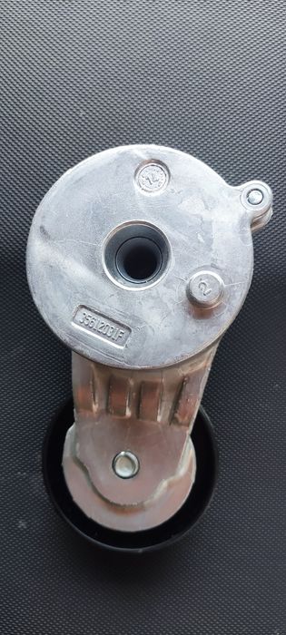 Натяжний ролик 68027611AB ОРИГІНАЛ