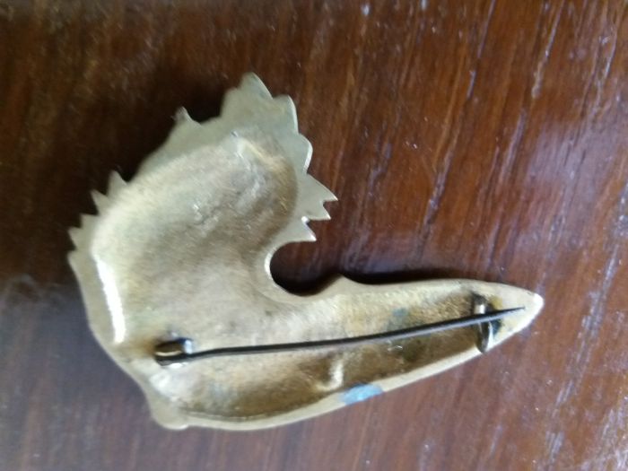 Alfinete cabeça de um cão muito antigo