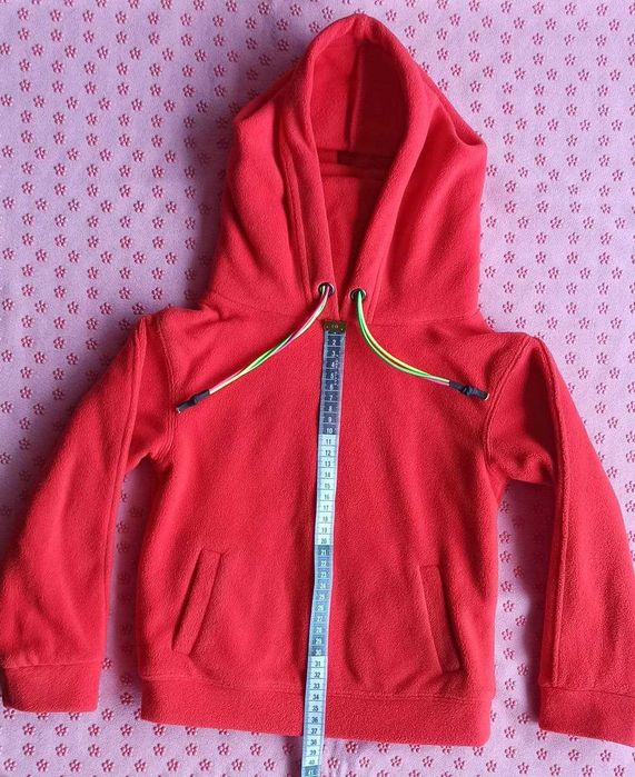 Unisex fleece jacket with a hood and a high collar. Very warm