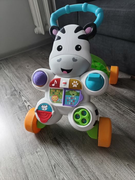 Pchacz jeździk fisher price