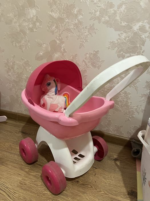 Іграшкова коляска для ляльки