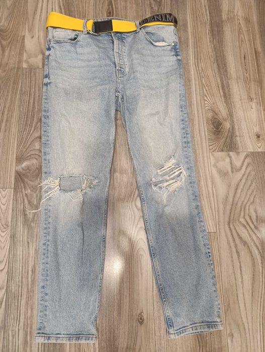 Spodnie damskie dżinsowe z dziurami r 42 Sinsay