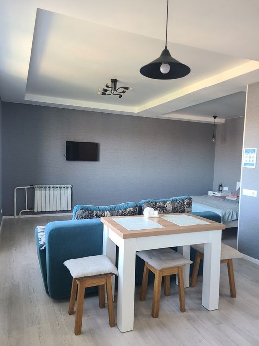 Затишна студія в центрі з балконом і видом на місто