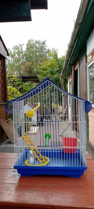 клітка для папуги велика