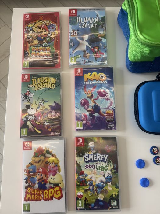 Nintendo switch zestaw ( 3xetui, 6 gier, dodatkowe pady, nakladki)