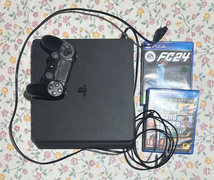 PlayStation 4 (1TB) com comando e 2 jogos