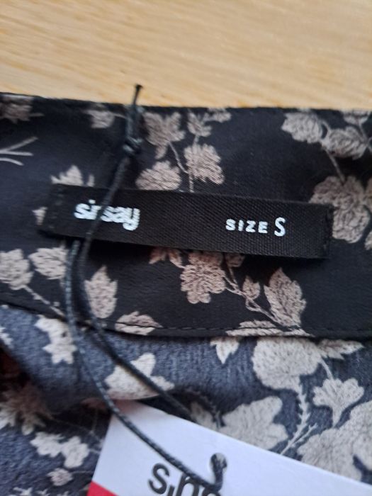 Nowa asymetryczna spódnica midi