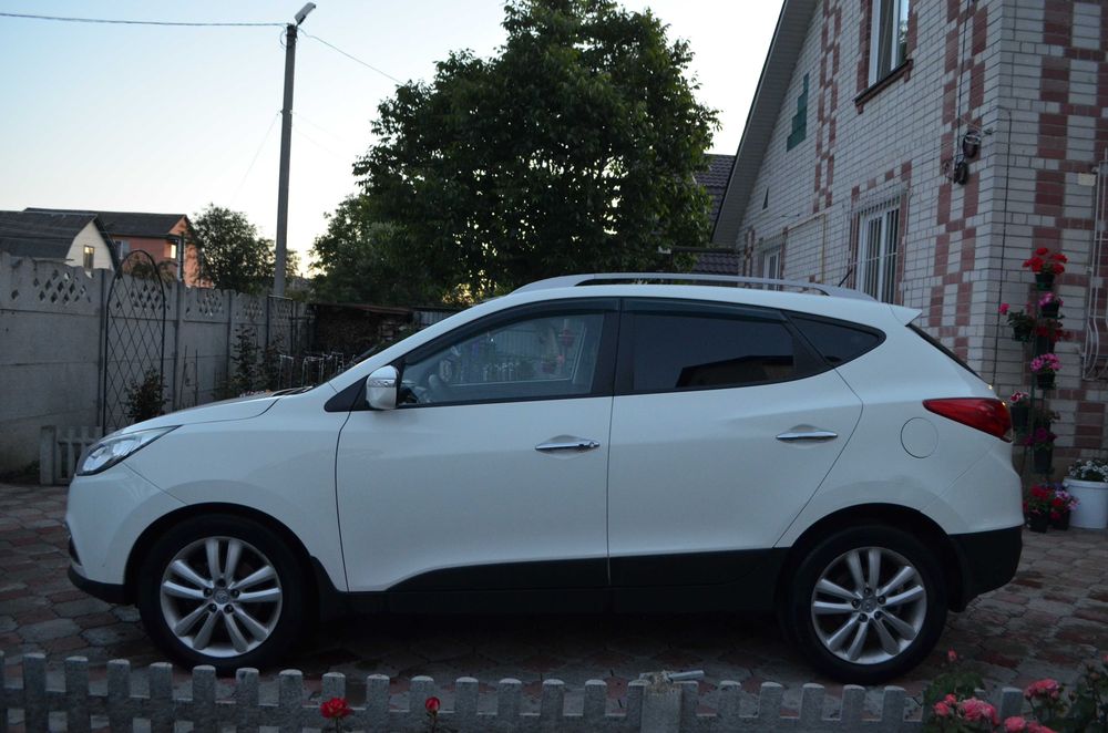 Hyundai ix35 2010 VIN KMHJU81CDBU167650 фото оголошення 4 з 24